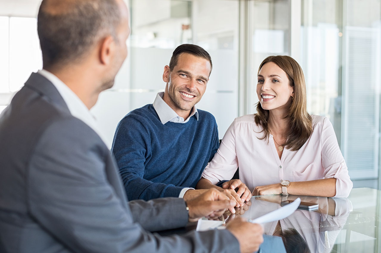 A couple talking to a lawyer